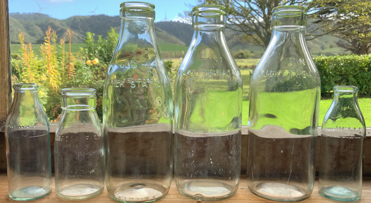 Six vintage New Zealand Glass Milk Bottles